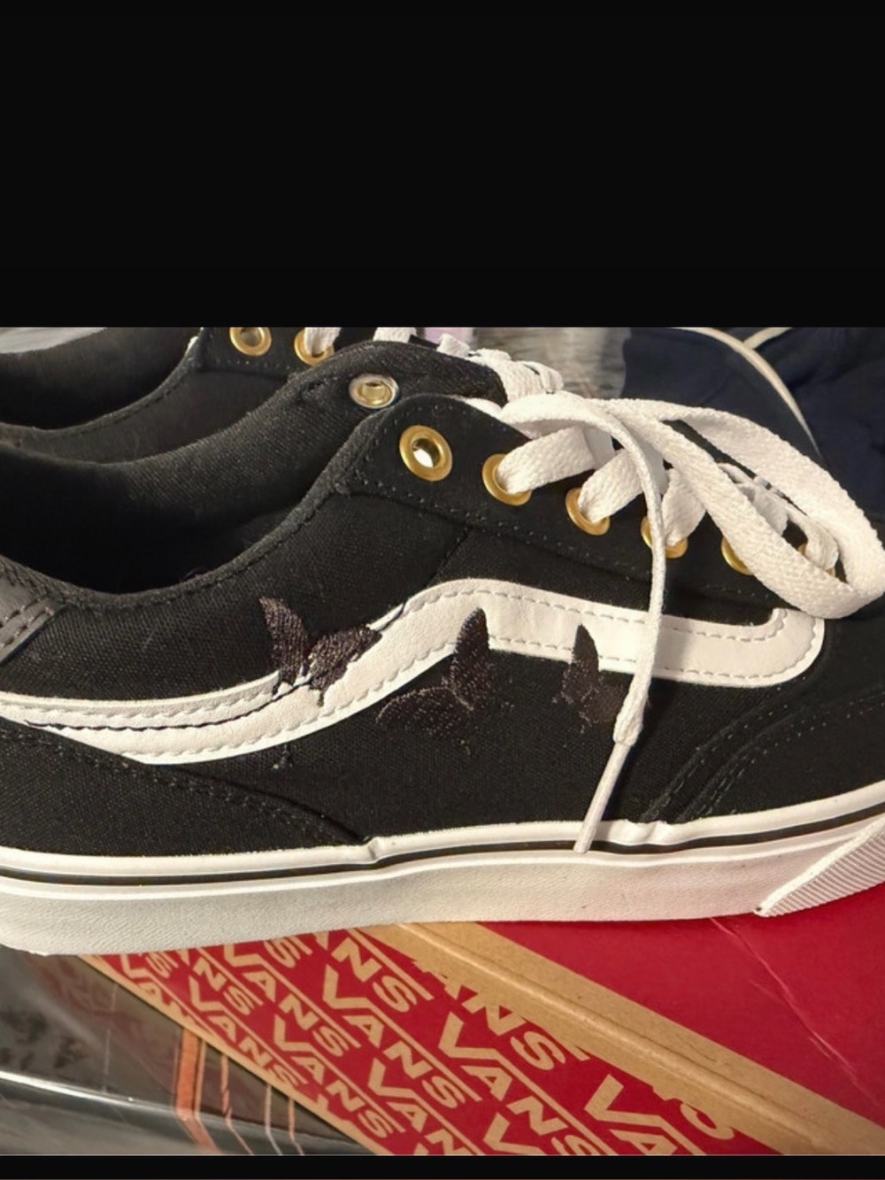 Vans Black and White Low-Top Sneakers with Gold Eyelets